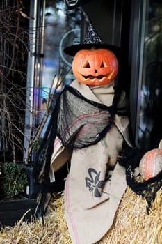 scarecrow for halloween. Halloween holiday concept. Scarecrow with pumpkins. Thanksgiving Day. Evil scarecrow costume. selective focus.