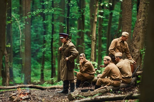 TERNOPIL, UKRAINE - June 2020 UPA Ukrainian Insurgent Army movie filming. Pictures of backstage. Soldiers taking a rest in the forest.