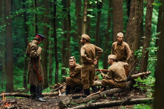 TERNOPIL, UKRAINE - June 2020 UPA Ukrainian Insurgent Army movie filming. Pictures of backstage. Soldiers taking a rest in the forest.