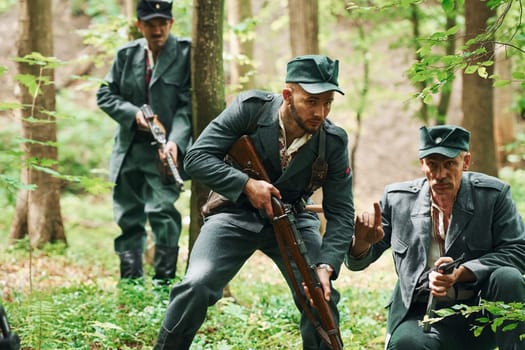 TERNOPIL, UKRAINE - June 2020 UPA Ukrainian Insurgent Army movie filming. Pictures of backstage. Young and old soldiers with weapons is attacking.