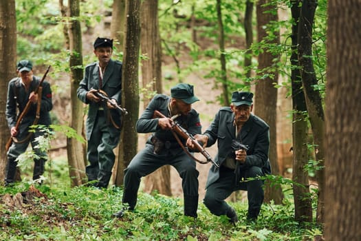 TERNOPIL, UKRAINE - June 2020 UPA Ukrainian Insurgent Army movie filming. Pictures of backstage. Young and old soldiers with weapons is attacking.