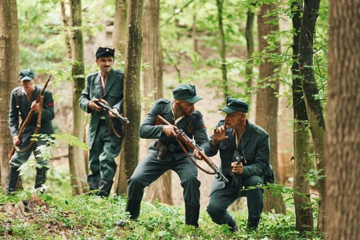 TERNOPIL, UKRAINE - June 2020 UPA Ukrainian Insurgent Army movie filming. Pictures of backstage. Young and old soldiers with weapons is attacking.