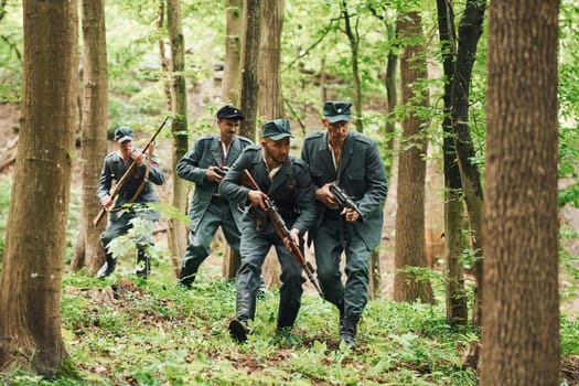 TERNOPIL, UKRAINE - June 2020 UPA Ukrainian Insurgent Army movie filming. Pictures of backstage. Young and old soldiers with weapons is attacking.