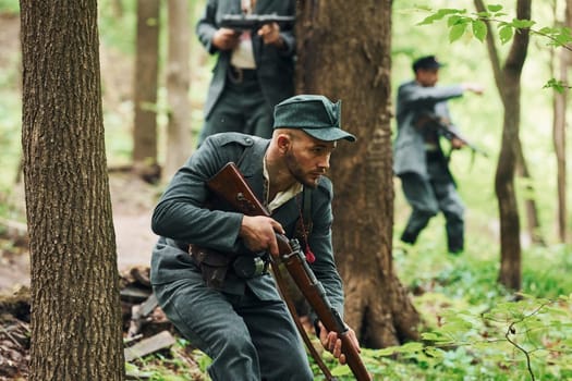 TERNOPIL, UKRAINE - June 2020 UPA Ukrainian Insurgent Army movie filming. Pictures of backstage. Young and old soldiers with weapons is attacking.