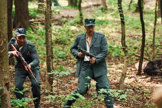 TERNOPIL, UKRAINE - June 2020 UPA Ukrainian Insurgent Army movie filming. Pictures of backstage. Young and old soldiers with weapons is attacking.