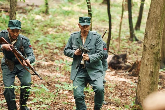 TERNOPIL, UKRAINE - June 2020 UPA Ukrainian Insurgent Army movie filming. Pictures of backstage. Young and old soldiers with weapons is attacking.