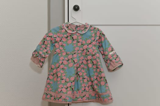 Velvet dress hanging on a hanger