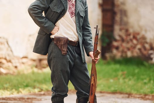 TERNOPIL, UKRAINE - June 2020 UPA Ukrainian Insurgent Army movie filming. Pictures of backstage. Close up view of young soldier with weapon.