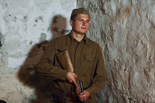 TERNOPIL, UKRAINE - June 2020 UPA Ukrainian Insurgent Army movie filming. Pictures of backstage. Young soldier indoors with weapon.