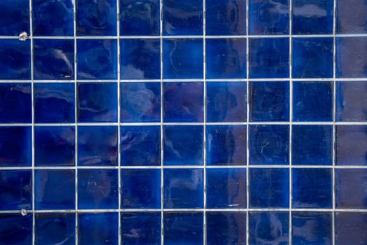 dark blue tile wall, abstract pattern mosaic background, textured wall or floor in bathroom, Space For Text. High quality photo