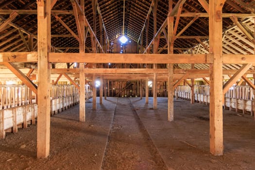 Historic Barn Interior with Wooden Beams at Pierce Point Dairy Farm. High quality photo