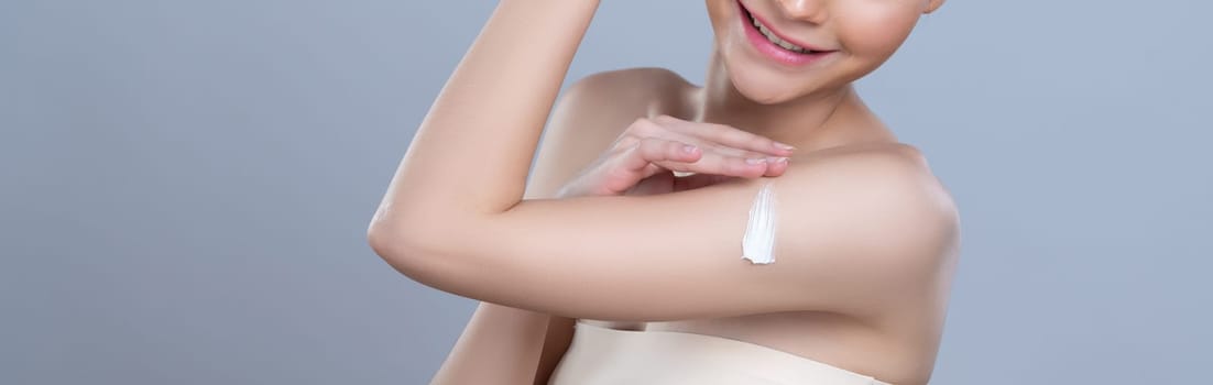 Closeup glamorous woman applying moisturizer cream on her arm for perfect skincare treatment in isolated background. Soft makeup young girl portrait with skin rejuvenation and cosmetology concept.