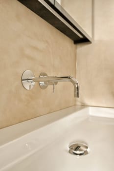 a bathroom sink with the faucet on it's wall mounted faucet is shown in the background