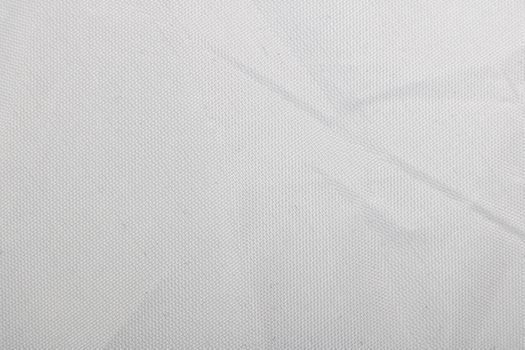 White pleated fabric close up, texture or background for text