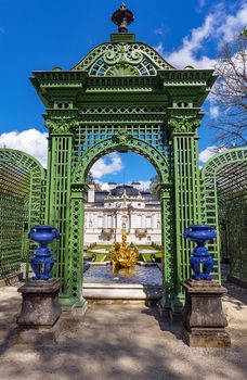 Part of the park with a fountain, arch and sculptures of the Linderhof Palace in Bavaria, Germany, one of the castles of the former King Ludwig II. 