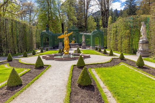 Part of the park with a fountain and sculptures of the Linderhof Palace in Bavaria, Germany, one of the castles of the former King Ludwig II. 