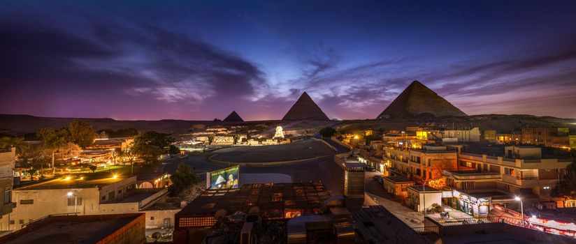 The Pyramids and the Sphinx in the night lights, Giza, Egypt
