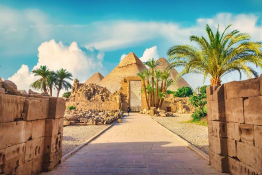 Luxor Karnak temple. The pylon with blue sky and pyramids