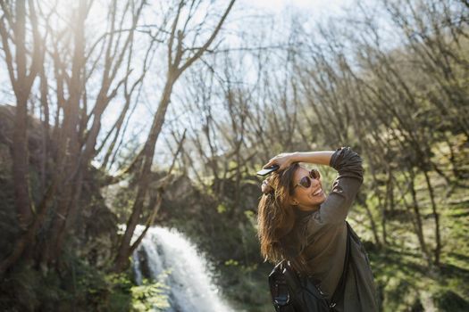 Shot of a carefree young woman enjoying the outdoors.