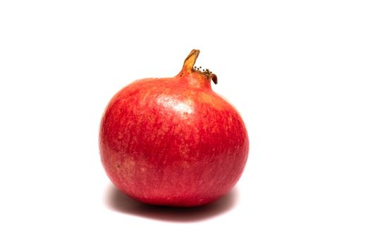 Red pomegranate fruit isolated on a white background