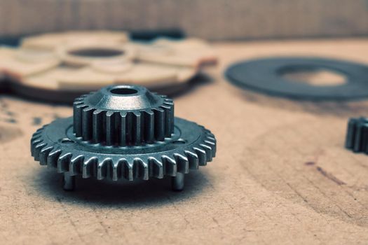 Gear close up on a red background with copy space