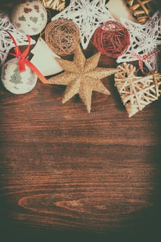 Christmas decoration in vintage toning on wooden background. Studio photo
