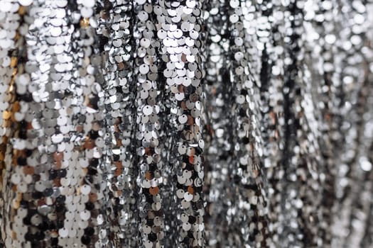 A close overhead view of silver sequins.