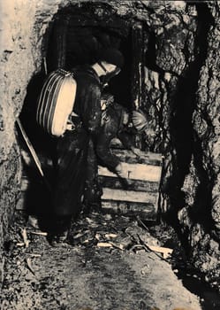 THE CZECHOSLOVAK SOCIALIST REPUBLIC - CIRCA 1960s: Retro photo shows miner rescuers in the coalmine. Black and white vintage photography