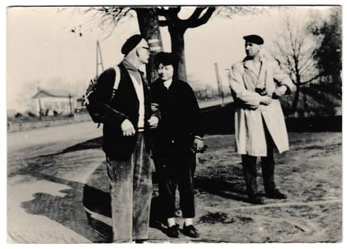 THE CZECHOSLOVAK SOCIALIST REPUBLIC - CIRCA 1960s: Retro photo shows tourists go for a walk. Black and white vintage photography
