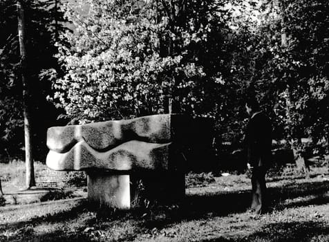 THE CZECHOSLOVAK SOCIALIST REPUBLIC - CIRCA 1960s: Retro photo shows stone monument in the park. Black & white vintage photography