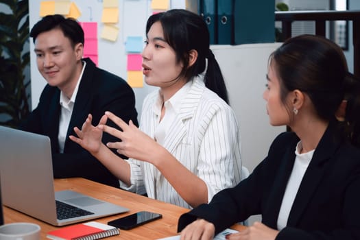 Business team of financial data analysis meeting with business intelligence, report paper and dashboard on laptop for marketing strategy. Business people working together to promote harmony in office.