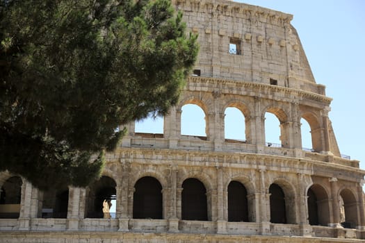 Rome, The Majestic Coliseum. Italy. Colosseum Rome. Ruins of the ancient Roman amphitheatre. Travel to Italy, Europe. Crowd and queue. Sunny day and blue sky