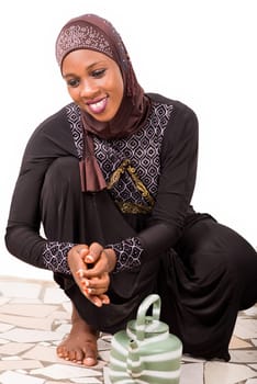 young muslim woman getting ready for prayer.