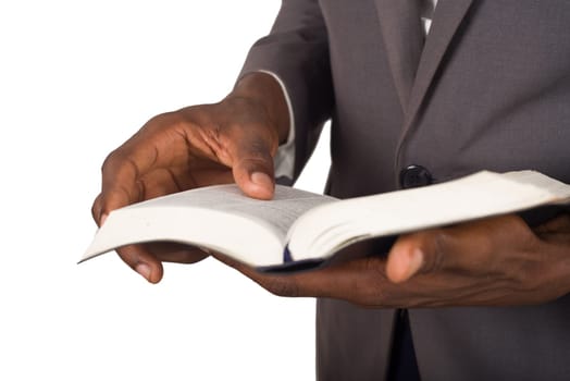 close up of hands of person flipping through a bible.