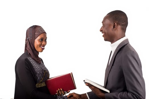 portraits of religious people holding religious documents each and greeting each other with a smile.