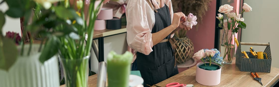 happy professional woman is working in flower shop