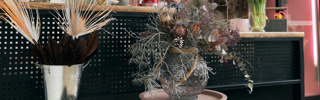 happy professional woman is working in flower shop