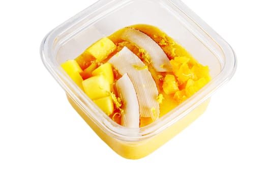 Smoothies with fresh fruits and nuts. Smoothie bowl, mango, passion fruit, coconut. Applesauce, lemon zest. High quality photo.