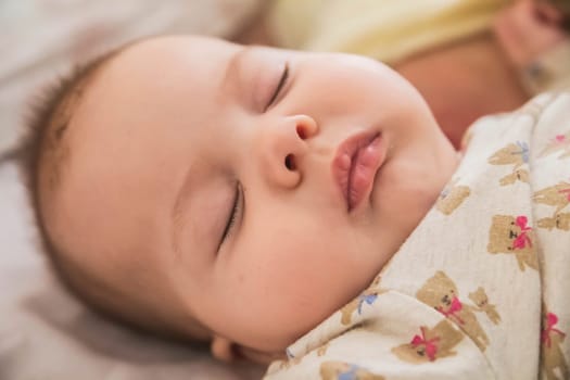 close-up face of a beautiful sleeping baby.