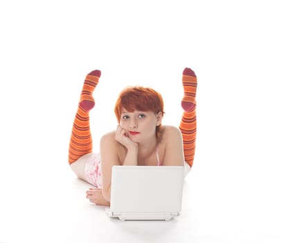 Red Girl in stripe socks with laptop on white background