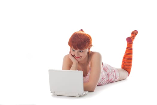 Red Girl in stripe socks with laptop on white background
