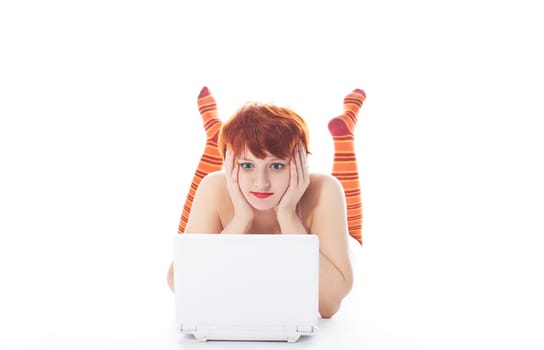 Girl in striped socks look at notebook and worried