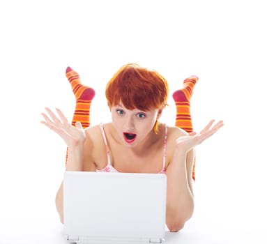 Girl in striped socks look at notebook surprised