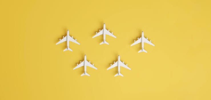Aircraft travelling to different destinations on yellow background. 3D rendering.