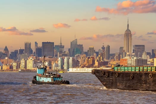 Cargo ship with Manhattan city skyline  of New York from New Jersey in USA