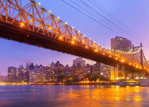 Manhattan city skyline cityscape of New York with Queen Bridge in USA