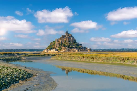 Famous Le Mont Saint-Michel tidal island in Normandy, northern France at sunset 