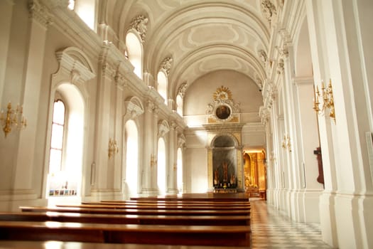 The bright interior of a Catholic church.