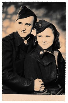 THE CZECHOSLOVAK SOCIALIST REPUBLIC - CIRCA 1940s: Retro photo shows soldiers - a pair of lovers. Vintage black and white photography.