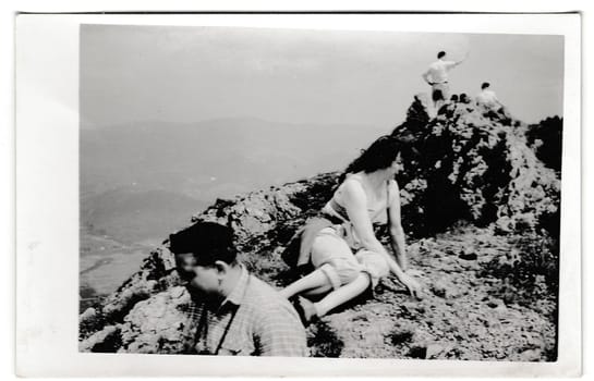 THE CZECHOSLOVAK SOCIALIST REPUBLIC - CIRCA 1950s: Retro photo shows tourists at the top of the hill. Summer vacation theme. Vintage black and white photography.